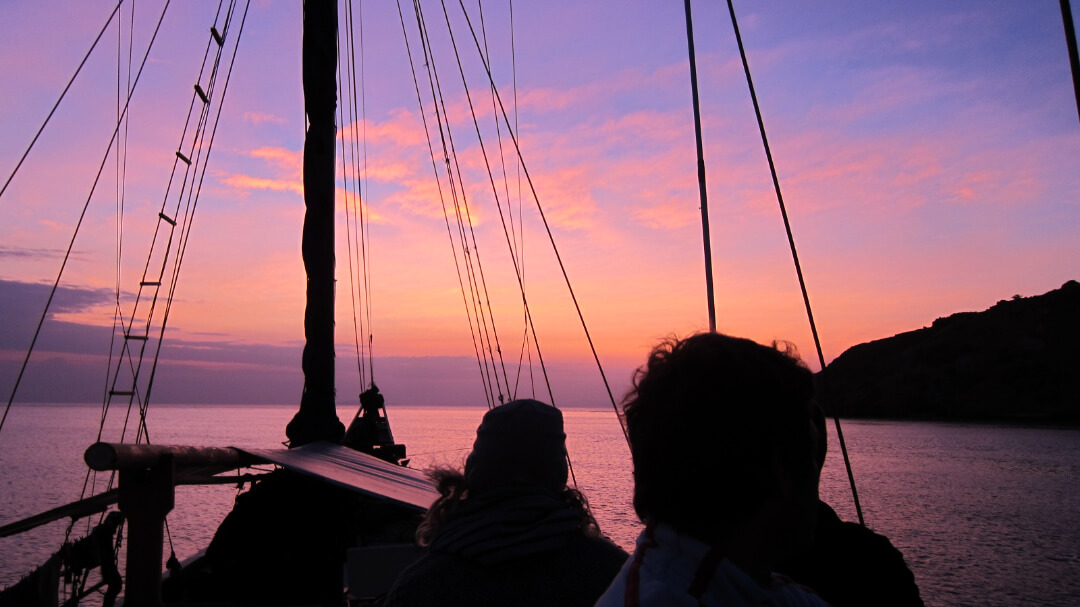 sailing Komodo National Park Indonesia at sunset