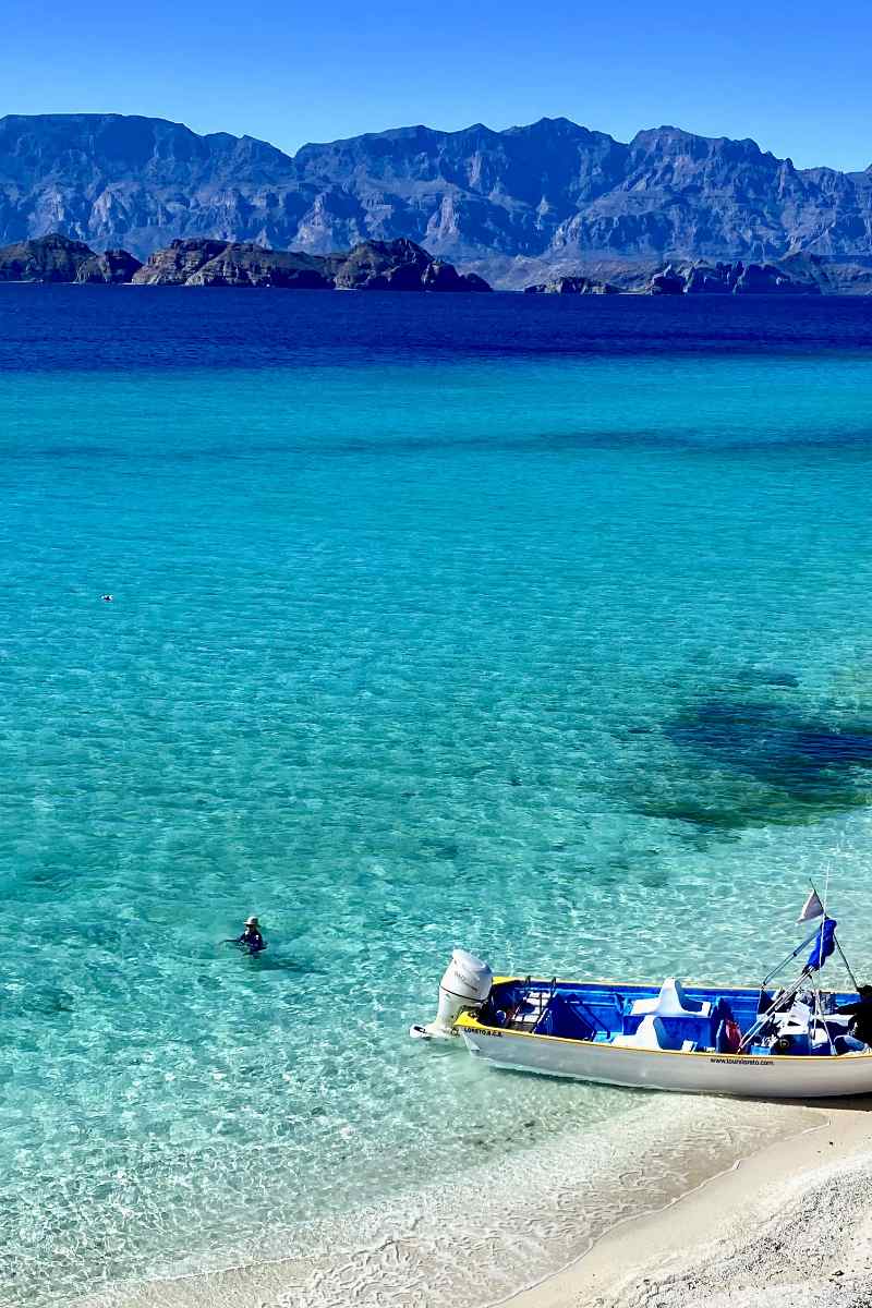 A beautiful secluded beach of Isla Carmen of Loreto Bay National Park, Baja California Sur, Mexico with calm turquoise water and rich landscape, reachable by boat trip
