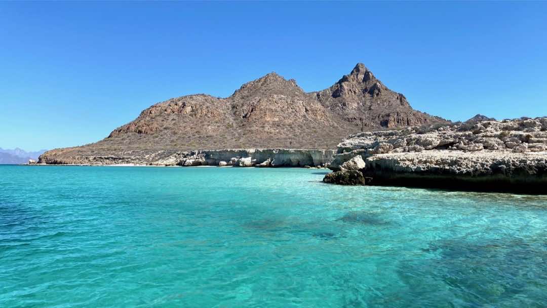 White rocks, mountains contrasting the turquoise waters of Isla Carmen, Loreto