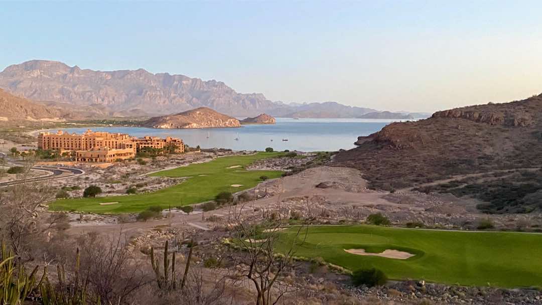 The secluded Villa del Parlmar and the Danzante Bay Golf overlook the bay at sunrise