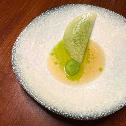 A course of the tasting menu, with different flavors extracted from different parts of spring peas in different ways, at Restaurant Nav in Zagreb, Croatia