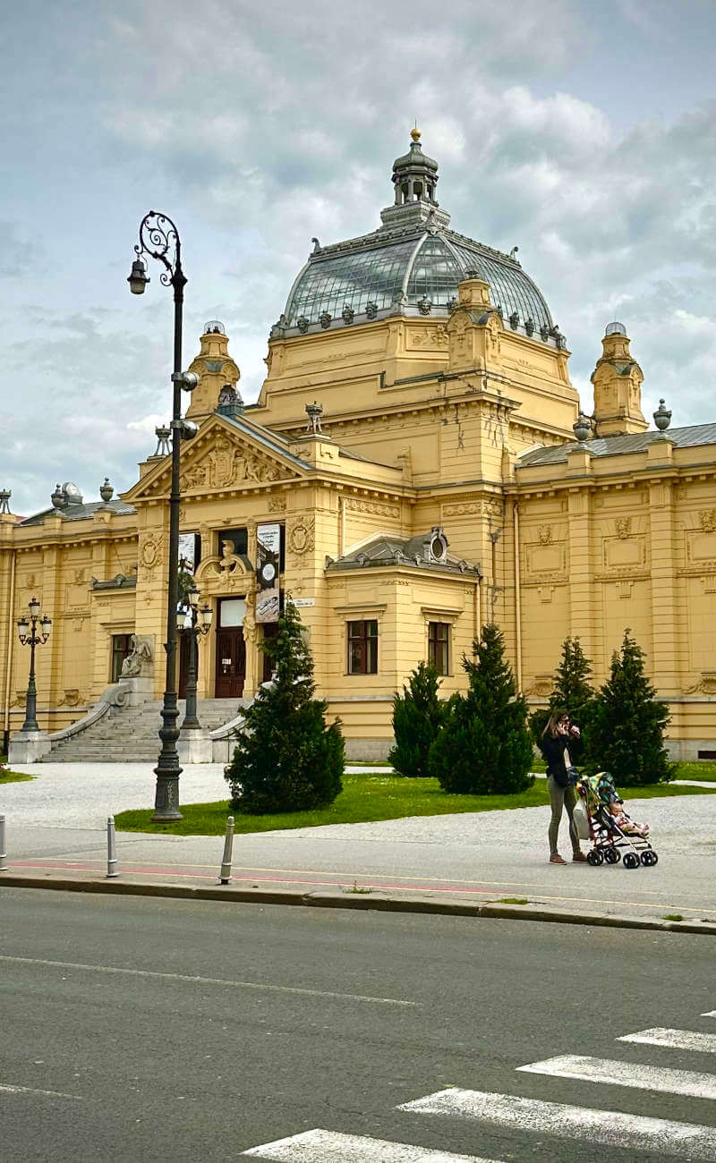 The stunning yellow Art Pavilion building in Zagreb, Croatia, in Hungarian architecture style