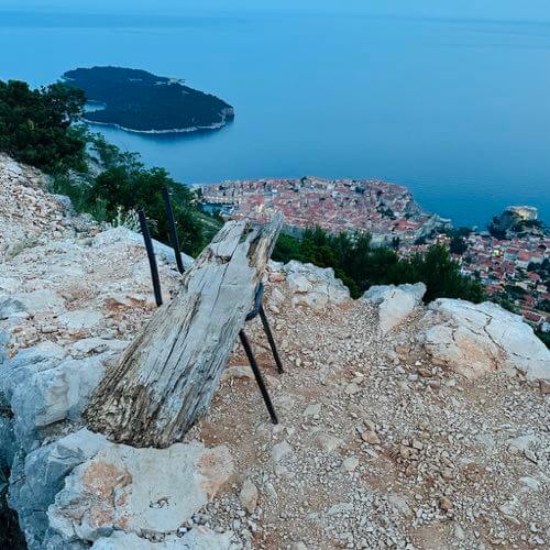 A random chair at the Dadiro Viera viewpoint facing Elaphiti Islands, directly down on the left hand side is Dubrovnik Old Town, Croatia