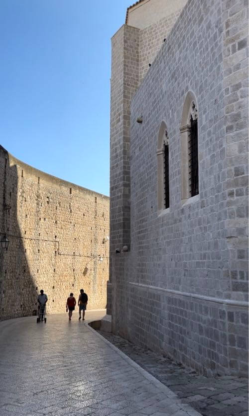 The walk from the East Entrance Ploče Gate, next to the tall city walls of Dubrovnik, Croatia