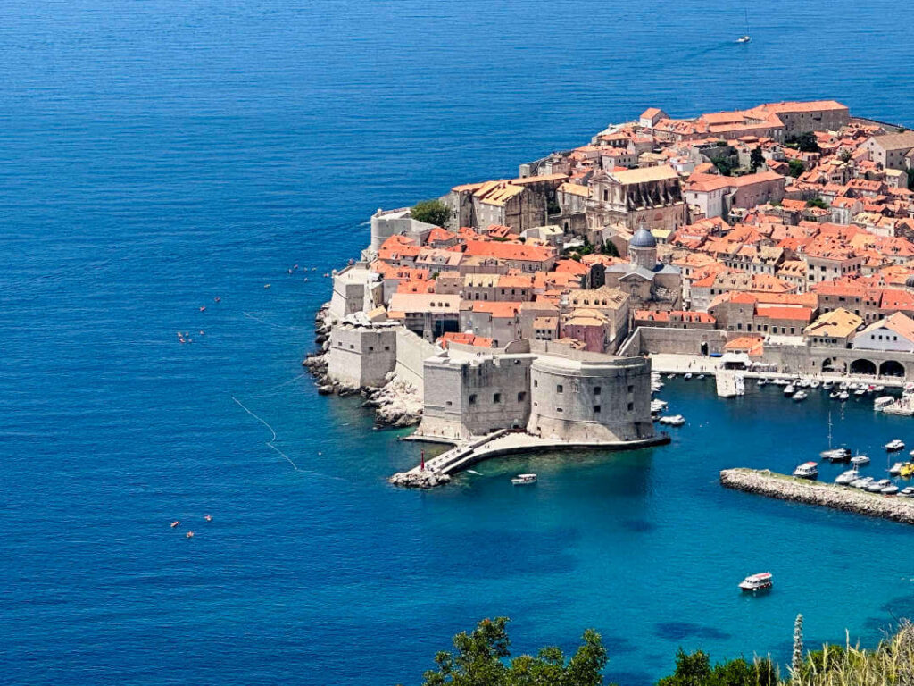 Kayakers sea kayaking around Dubrovnik Old Town, Croatia