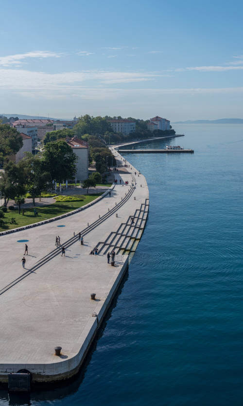 Aerial view of the Sea Organ and seaside promenade in Zadar, with a clear view of the steps above the underwater Sea organ instrument in Croatia