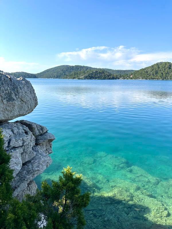 Secret swimming spot in turquoise saltwater around the Great Lake in Mljet National Park, Croatia