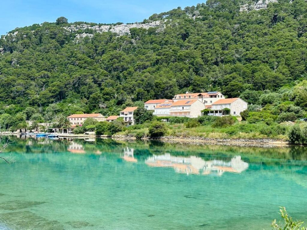 Soline village with turquoise Soline channel in front and mountains behind in Mljet National Park, Croatia