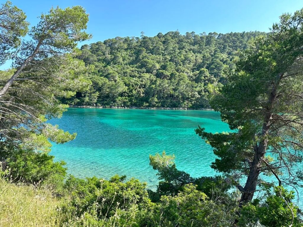 View of turquoise waters of different shades in Soline channel from biking in Mljet National Park, Croatia