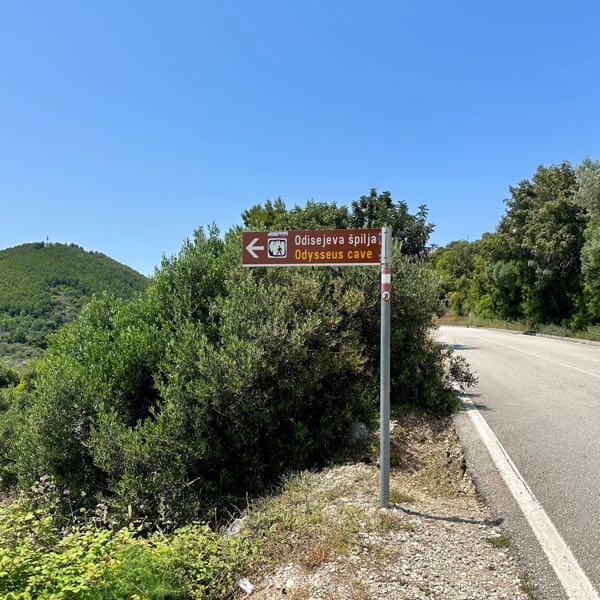 Sign to Odysseus cave from the main road on the island of Mljet, Croatia