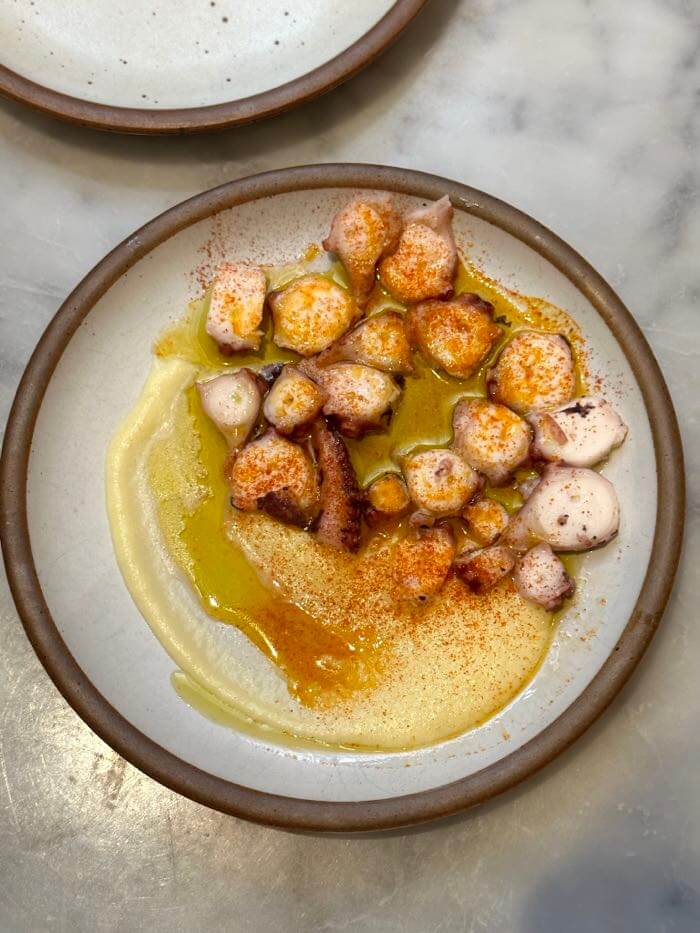 Cúrate's pulpo a la gallega, warm Galician style octopus with sea salt, olive oil, Spanish paprika, and yukon gold potato puree, in Asheville, North Carolina