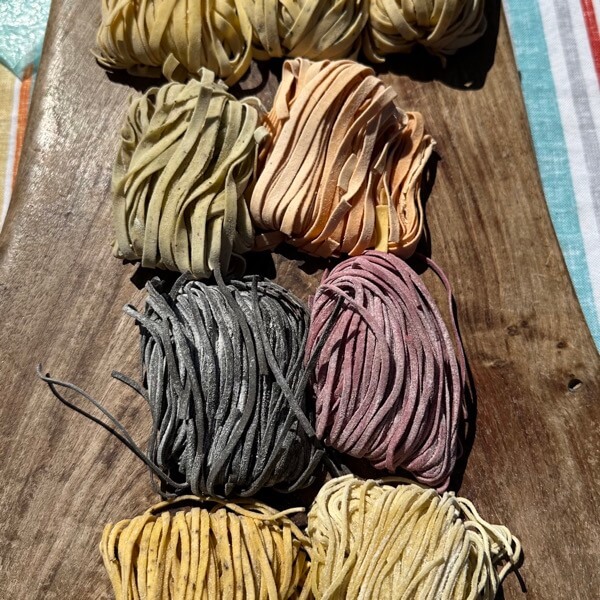 Freshly made raw pasta in various flavors at the downtown city farmers market in Asheville, North Carolina